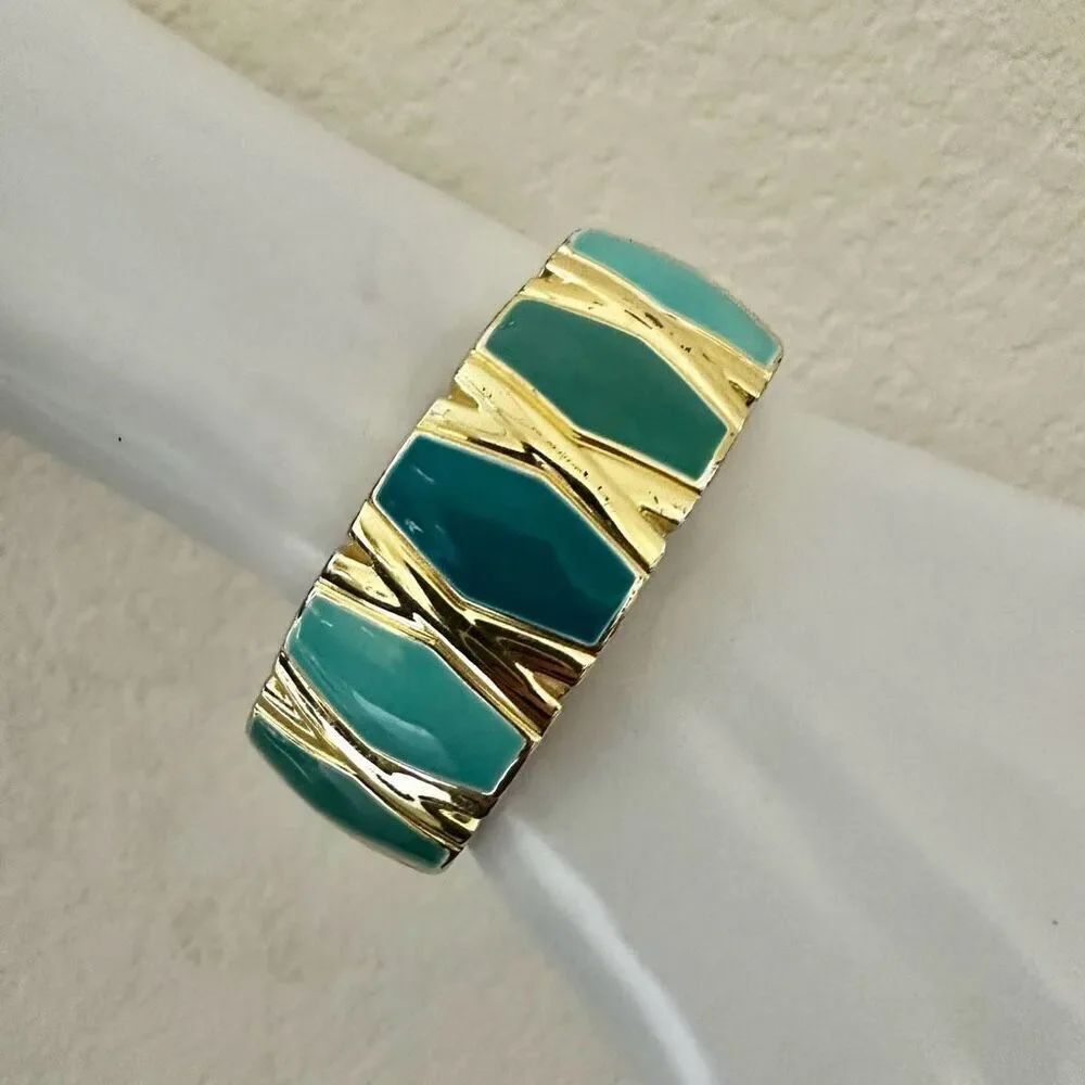 Blue and gold tone hinged bangle bracelet